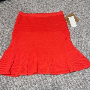 Bright orange/salmon Color skirt.